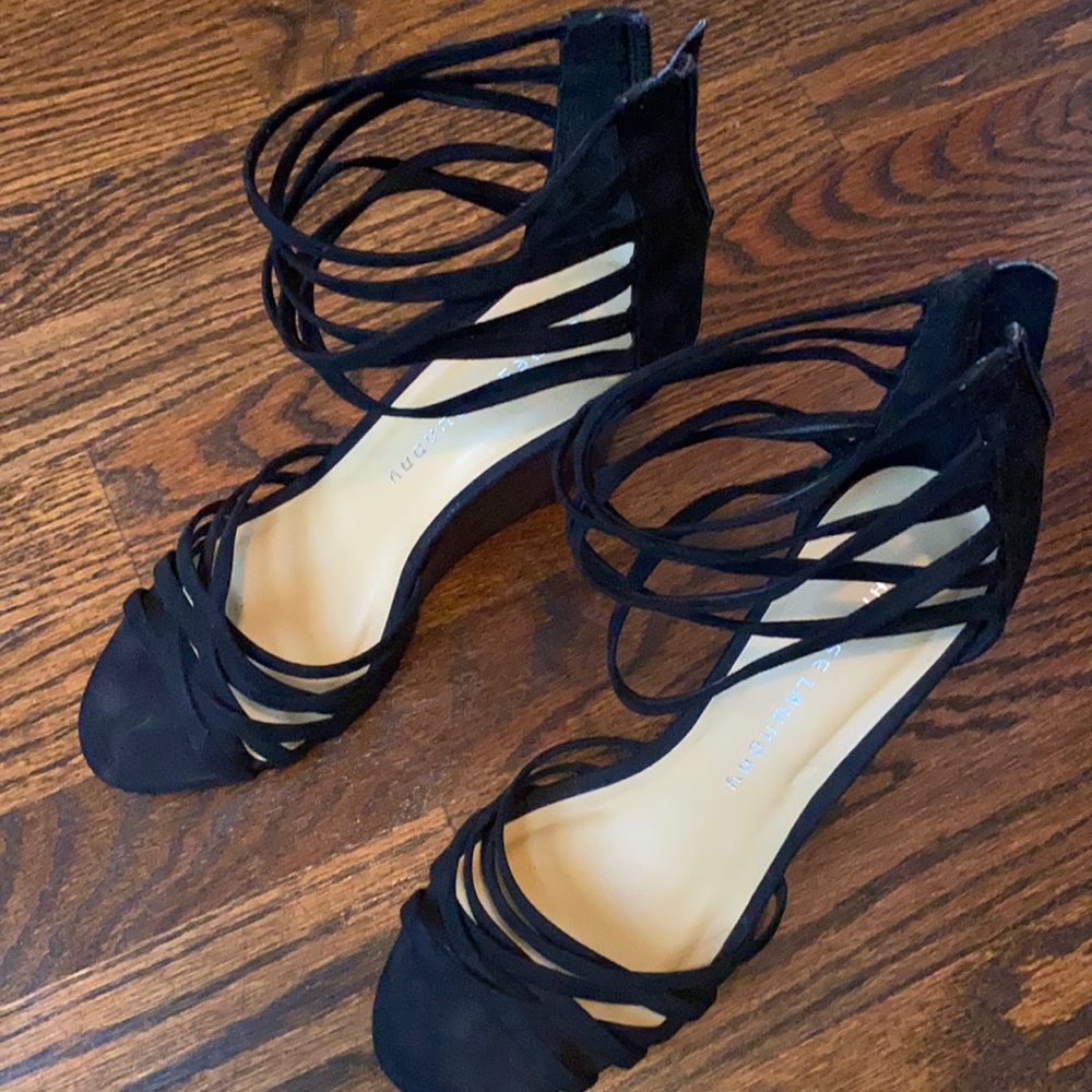 Black suede finish platform heels.